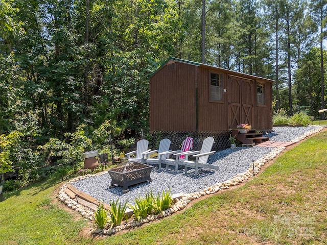 334 Arbra Mountain Way, Bostic, NC 28018 - view of shed with a fire pit