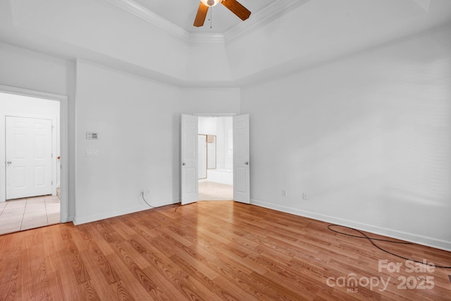 5138 Foxbriar Trl, Charlotte, NC 28269 - unfurnished room with a ceiling fan, crown molding, light wood finished floors, and a raised ceiling