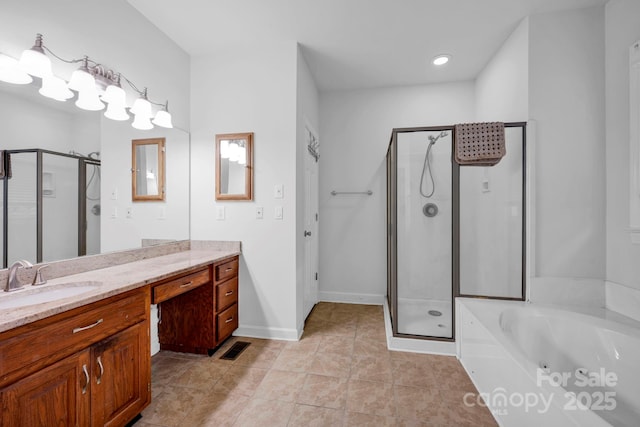 5138 Foxbriar Trl, Charlotte, NC 28269 - full bathroom featuring a stall shower, vanity, a whirlpool tub, tile patterned floors, and recessed lighting