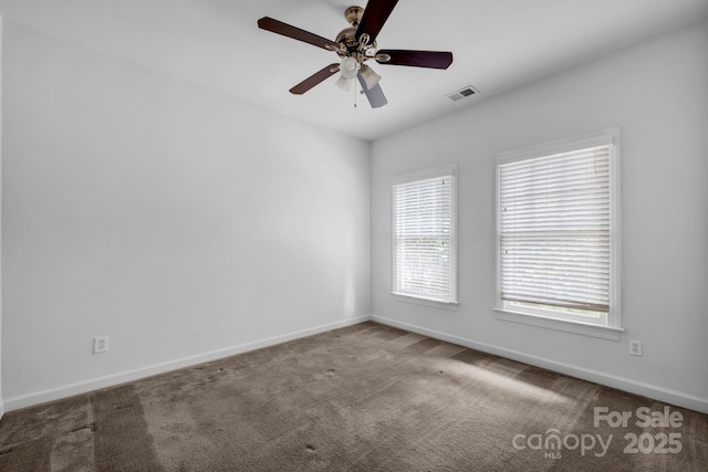 5138 Foxbriar Trl, Charlotte, NC 28269 - carpeted empty room featuring baseboards and a ceiling fan