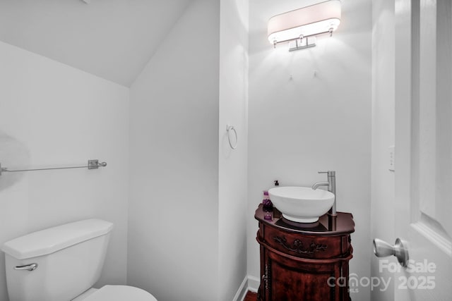 5138 Foxbriar Trl, Charlotte, NC 28269 - half bathroom with vanity and lofted ceiling
