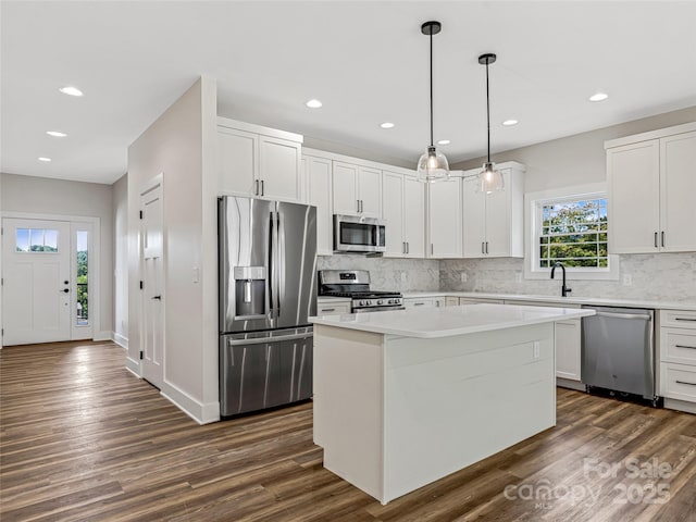 297 Bethany Dr, Mars Hill, NC 28754 - kitchen with stainless steel appliances, recessed lighting, dark wood-type flooring, backsplash, and a kitchen island