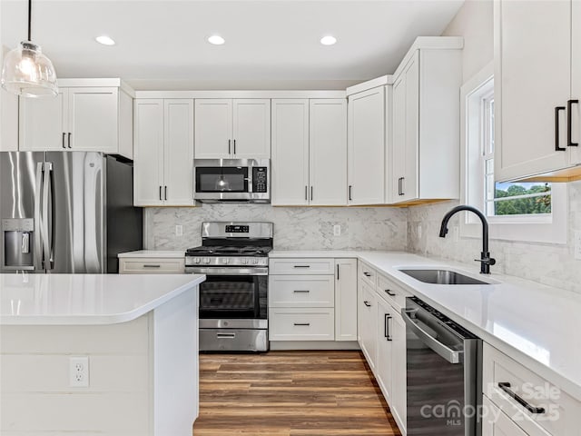 297 Bethany Dr, Mars Hill, NC 28754 - kitchen featuring stainless steel appliances, recessed lighting, wood finished floors, light countertops, and white cabinets