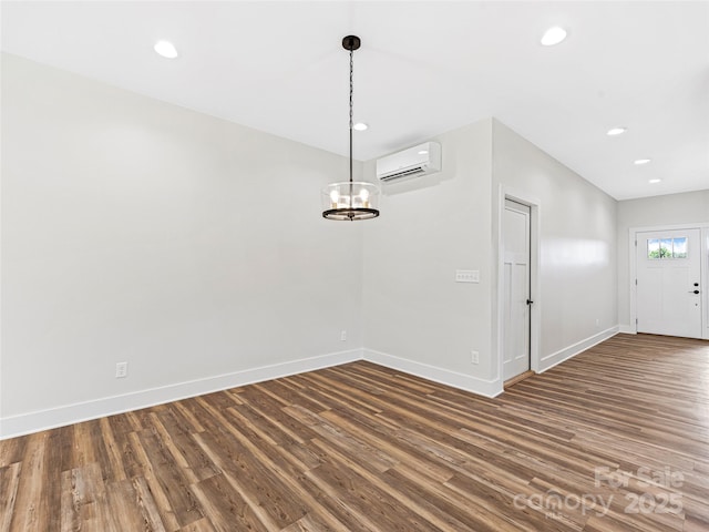 297 Bethany Dr, Mars Hill, NC 28754 - unfurnished room with a wall mounted AC, wood finished floors, a chandelier, and recessed lighting