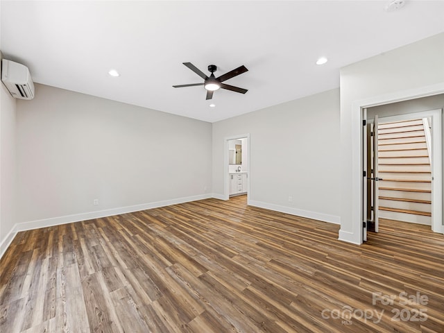 297 Bethany Dr, Mars Hill, NC 28754 - spare room featuring an AC wall unit, ceiling fan, wood finished floors, and recessed lighting