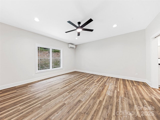297 Bethany Dr, Mars Hill, NC 28754 - spare room with an AC wall unit, wood finished floors, ceiling fan, and recessed lighting