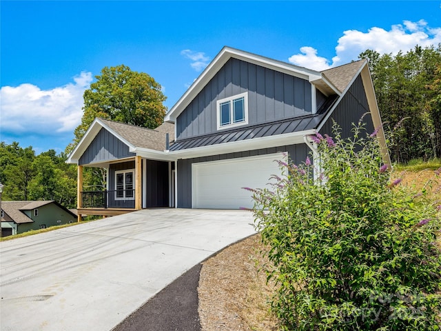 297 Bethany Dr, Mars Hill, NC 28754 - traditional-style house with a standing seam roof, board and batten siding, a shingled roof, a porch, and concrete driveway