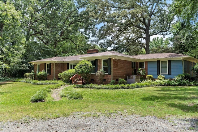 7010 Monroe Rd, Charlotte, NC 28212 - single story home with brick siding, a front lawn, a chimney, and crawl space
