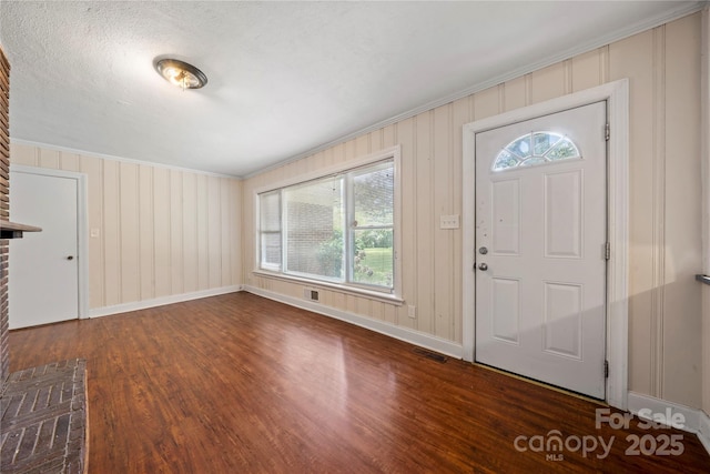 7010 Monroe Rd, Charlotte, NC 28212 - entrance foyer with wood finished floors and crown molding