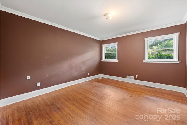 7010 Monroe Rd, Charlotte, NC 28212 - empty room featuring wood finished floors and ornamental molding