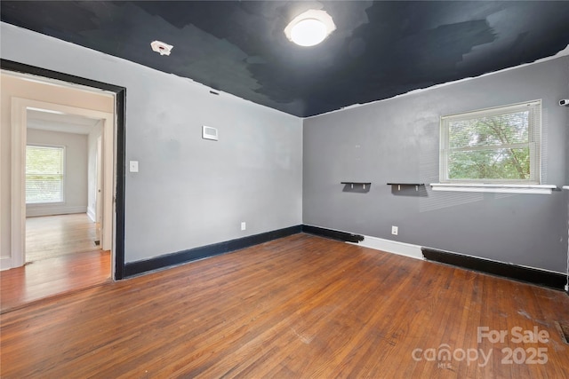 7010 Monroe Rd, Charlotte, NC 28212 - empty room with wood finished floors and baseboards