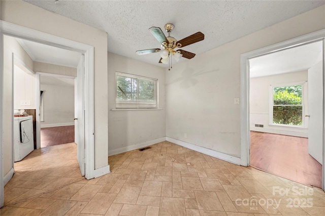 7010 Monroe Rd, Charlotte, NC 28212 - spare room with a ceiling fan, healthy amount of natural light, washer / dryer, and a textured ceiling