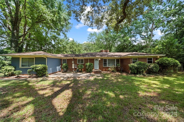 7010 Monroe Rd, Charlotte, NC 28212 - ranch-style home featuring a front yard, brick siding, and a chimney