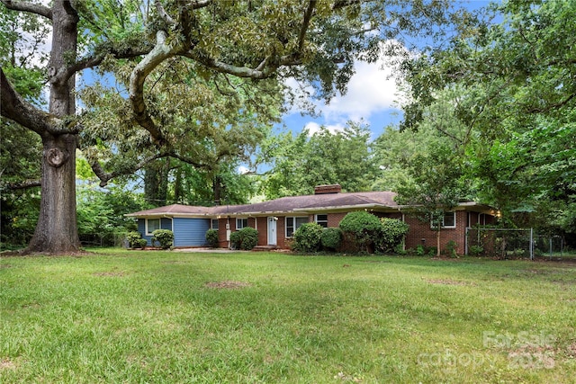 7010 Monroe Rd, Charlotte, NC 28212 - ranch-style home with brick siding, a chimney, and a front lawn