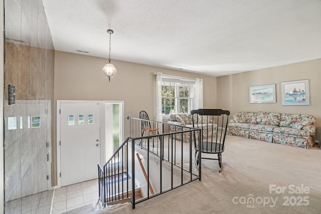 25 Hazel Ct, Brevard, NC 28712 - carpeted entryway with a textured ceiling