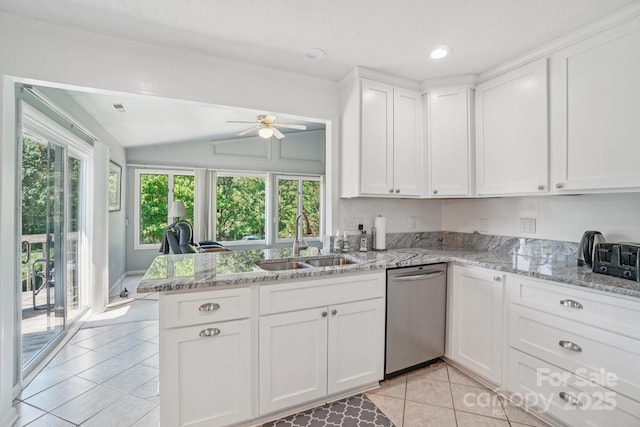 25 Hazel Ct, Brevard, NC 28712 - kitchen featuring dishwasher, white cabinets, a peninsula, light tile patterned floors, and vaulted ceiling