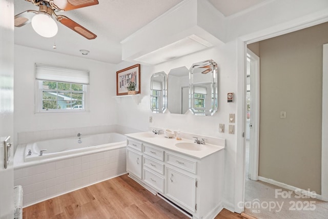25 Hazel Ct, Brevard, NC 28712 - full bathroom featuring double vanity, a bath, ceiling fan, and wood finished floors