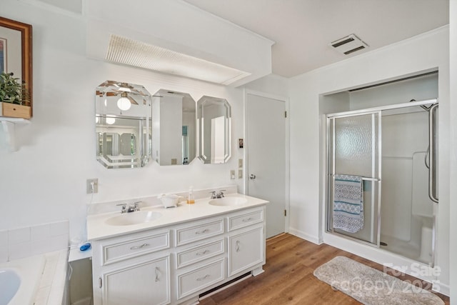 25 Hazel Ct, Brevard, NC 28712 - full bathroom featuring a shower stall, double vanity, wood finished floors, and a bathtub