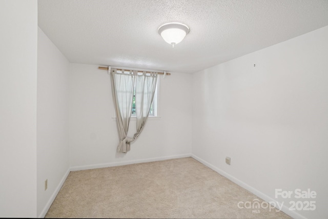 25 Hazel Ct, Brevard, NC 28712 - carpeted empty room featuring a textured ceiling and baseboards