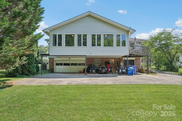 25 Hazel Ct, Brevard, NC 28712 - view of front of house with concrete driveway, an attached garage, brick siding, and a front yard