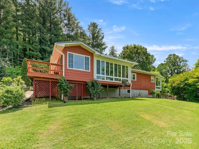 30 Belleview Rd, Waynesville, NC 28786 - rear view of house featuring a wooden deck, a sunroom, and a lawn