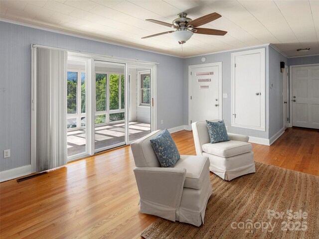 30 Belleview Rd, Waynesville, NC 28786 - living area with crown molding, light wood-style floors, and ceiling fan