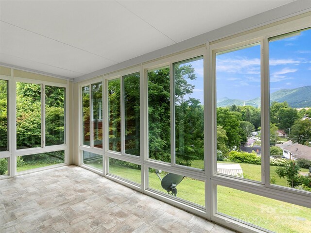 30 Belleview Rd, Waynesville, NC 28786 - unfurnished sunroom with stone finish flooring and a mountain view