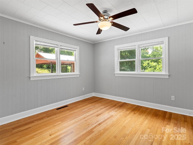 30 Belleview Rd, Waynesville, NC 28786 - empty room featuring light wood finished floors, healthy amount of natural light, ornamental molding, and ceiling fan