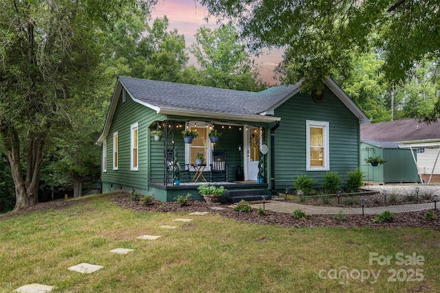 1114 Mountain St, Kannapolis, NC 28081 - view of front facade featuring covered porch, a front lawn, and roof with shingles