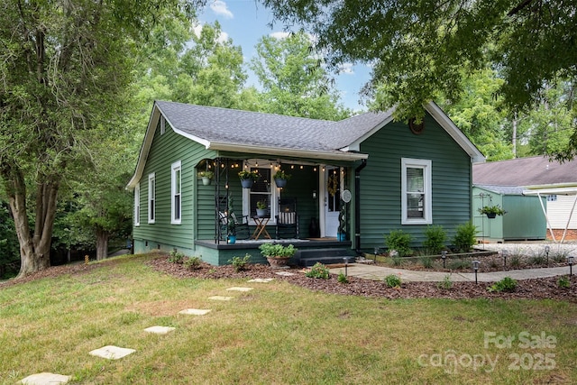1114 Mountain St, Kannapolis, NC 28081 - view of front facade with covered porch, a front lawn, and a shingled roof