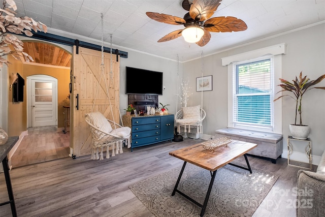 1114 Mountain St, Kannapolis, NC 28081 - living area with wood finished floors, a barn door, crown molding, and ceiling fan