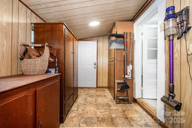 1114 Mountain St, Kannapolis, NC 28081 - mudroom featuring wood ceiling, wooden walls, and stone finish floors