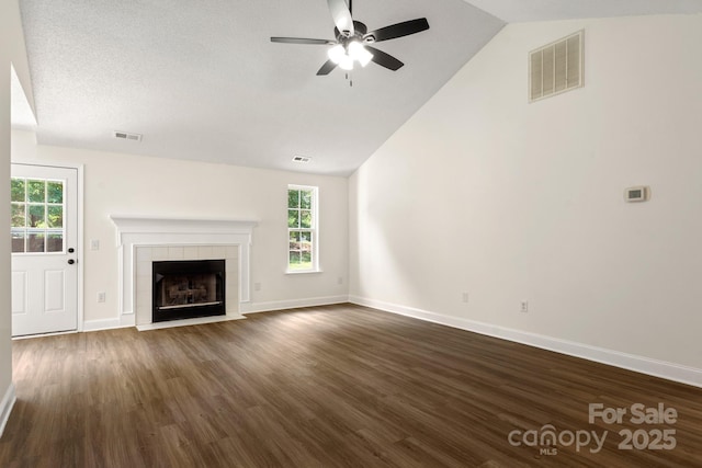 2210 Dawn Rdg, Monroe, NC 28110 - unfurnished living room with lofted ceiling, ceiling fan, healthy amount of natural light, and dark wood finished floors