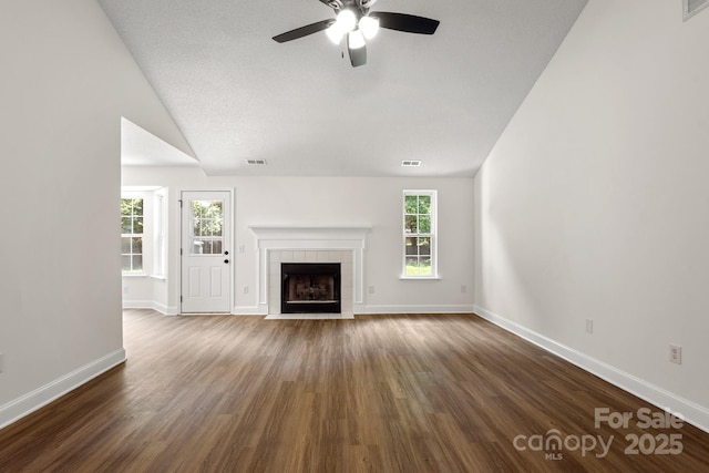 2210 Dawn Rdg, Monroe, NC 28110 - unfurnished living room featuring vaulted ceiling, ceiling fan, dark wood-type flooring, and a fireplace