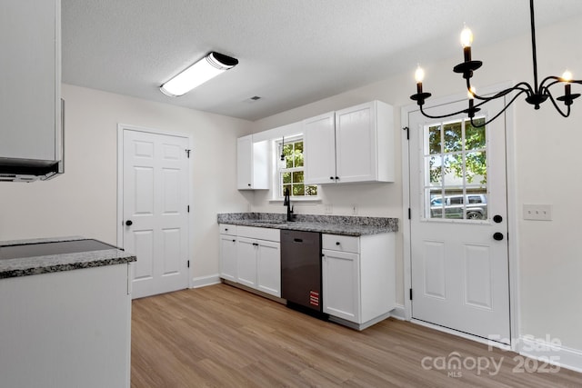 2210 Dawn Rdg, Monroe, NC 28110 - kitchen with dishwasher, a chandelier, light wood-style floors, white cabinets, and dark stone countertops