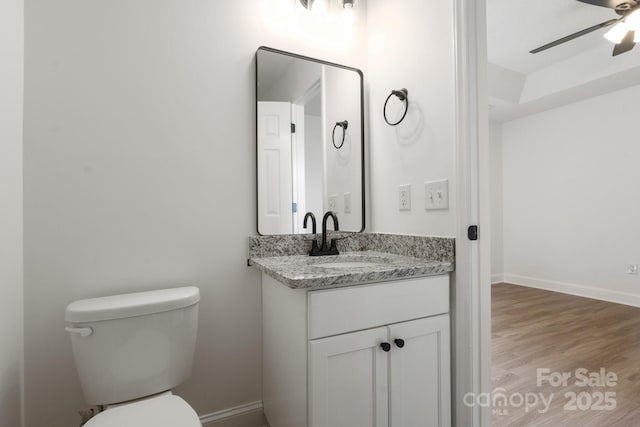 2210 Dawn Rdg, Monroe, NC 28110 - half bathroom with ceiling fan, vanity, and wood finished floors