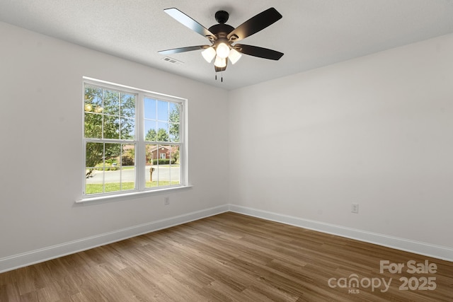 2210 Dawn Rdg, Monroe, NC 28110 - unfurnished room featuring wood finished floors and a ceiling fan