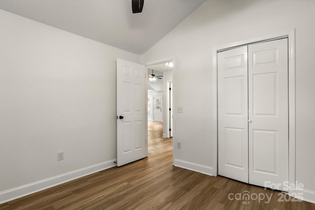 2210 Dawn Rdg, Monroe, NC 28110 - unfurnished bedroom featuring lofted ceiling, dark wood finished floors, a closet, and ceiling fan