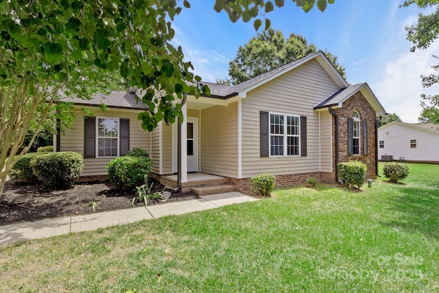 2210 Dawn Rdg, Monroe, NC 28110 - ranch-style home featuring a front lawn and roof with shingles