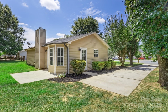 2210 Dawn Rdg, Monroe, NC 28110 - back of property with a chimney and a patio area