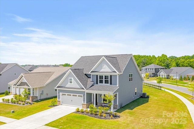 1302 Black Walnut St, Monroe, NC 28112 - view of front facade featuring concrete driveway, a front yard, a residential view, a shingled roof, and a porch
