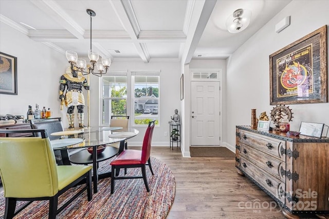 1302 Black Walnut St, Monroe, NC 28112 - dining space featuring wood finished floors, a chandelier, beamed ceiling, ornamental molding, and coffered ceiling