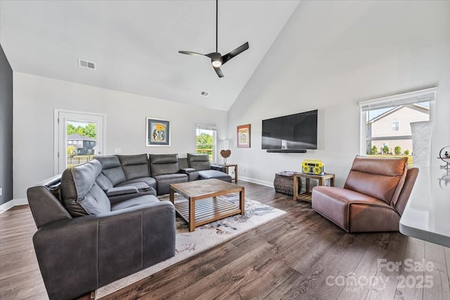 1302 Black Walnut St, Monroe, NC 28112 - living area featuring healthy amount of natural light, high vaulted ceiling, ceiling fan, and wood finished floors