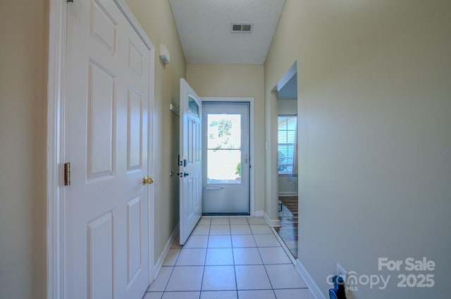 1975 8th Street Ln SE, Hickory, NC 28602 - doorway featuring light tile patterned flooring and a textured ceiling