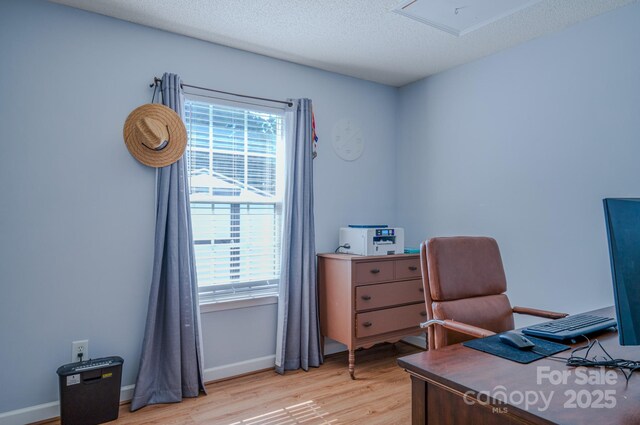 1975 8th Street Ln SE, Hickory, NC 28602 - office area featuring light wood-style flooring, plenty of natural light, and a textured ceiling