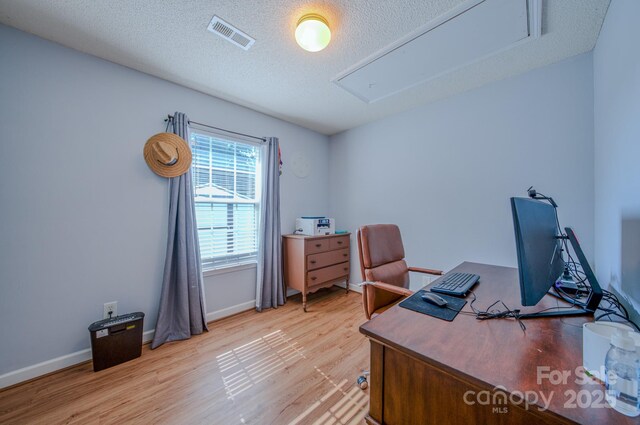 1975 8th Street Ln SE, Hickory, NC 28602 - office area featuring attic access, light wood-style flooring, and a textured ceiling