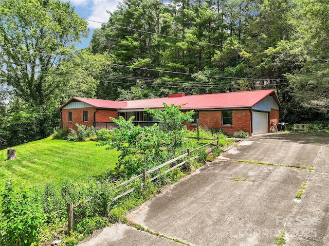 71 Auburn Park Dr, Waynesville, NC 28786 - single story home with brick siding, a garage, a front lawn, and driveway