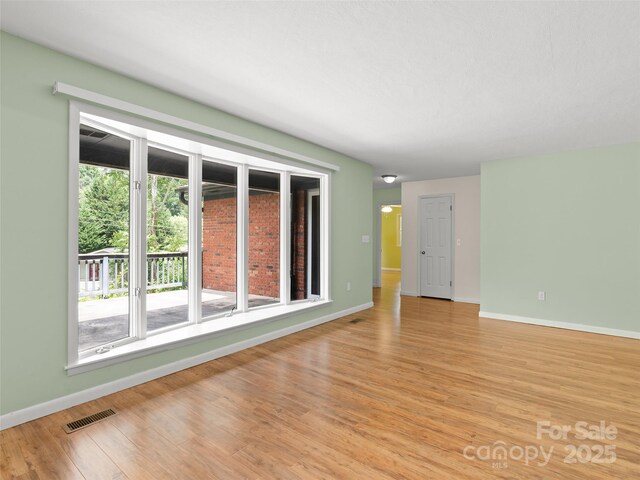 71 Auburn Park Dr, Waynesville, NC 28786 - spare room featuring baseboards and light wood finished floors