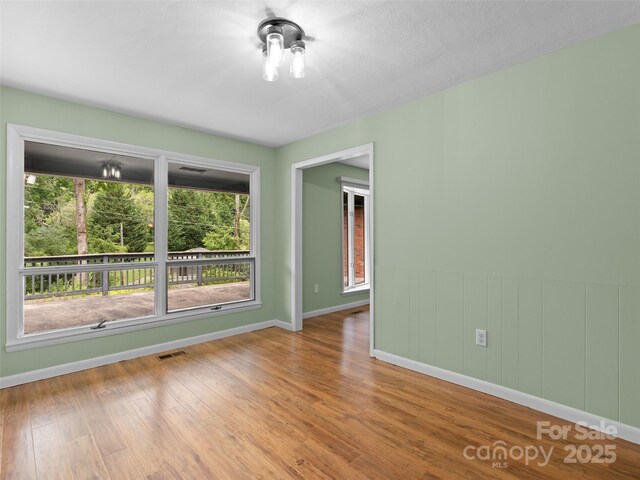 71 Auburn Park Dr, Waynesville, NC 28786 - unfurnished room featuring wood finished floors and baseboards