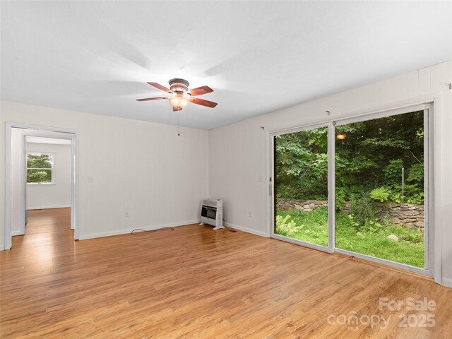 71 Auburn Park Dr, Waynesville, NC 28786 - spare room featuring heating unit, a ceiling fan, and light wood-type flooring